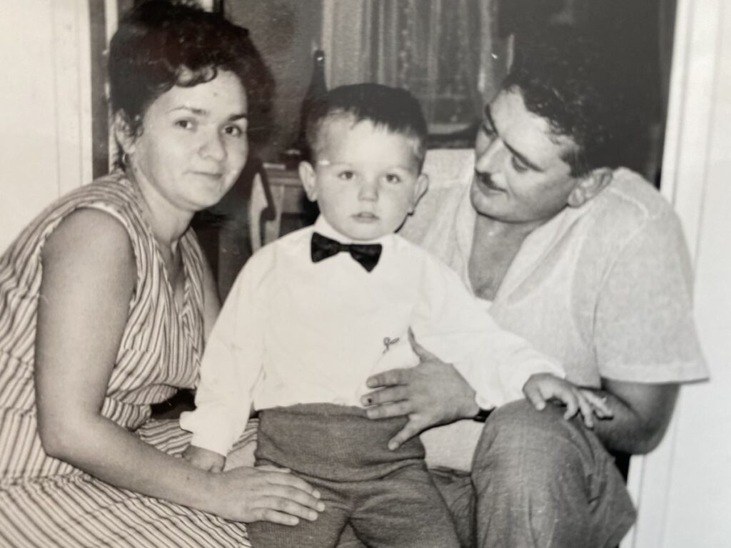 Sasa as a child accompanied by both his parents